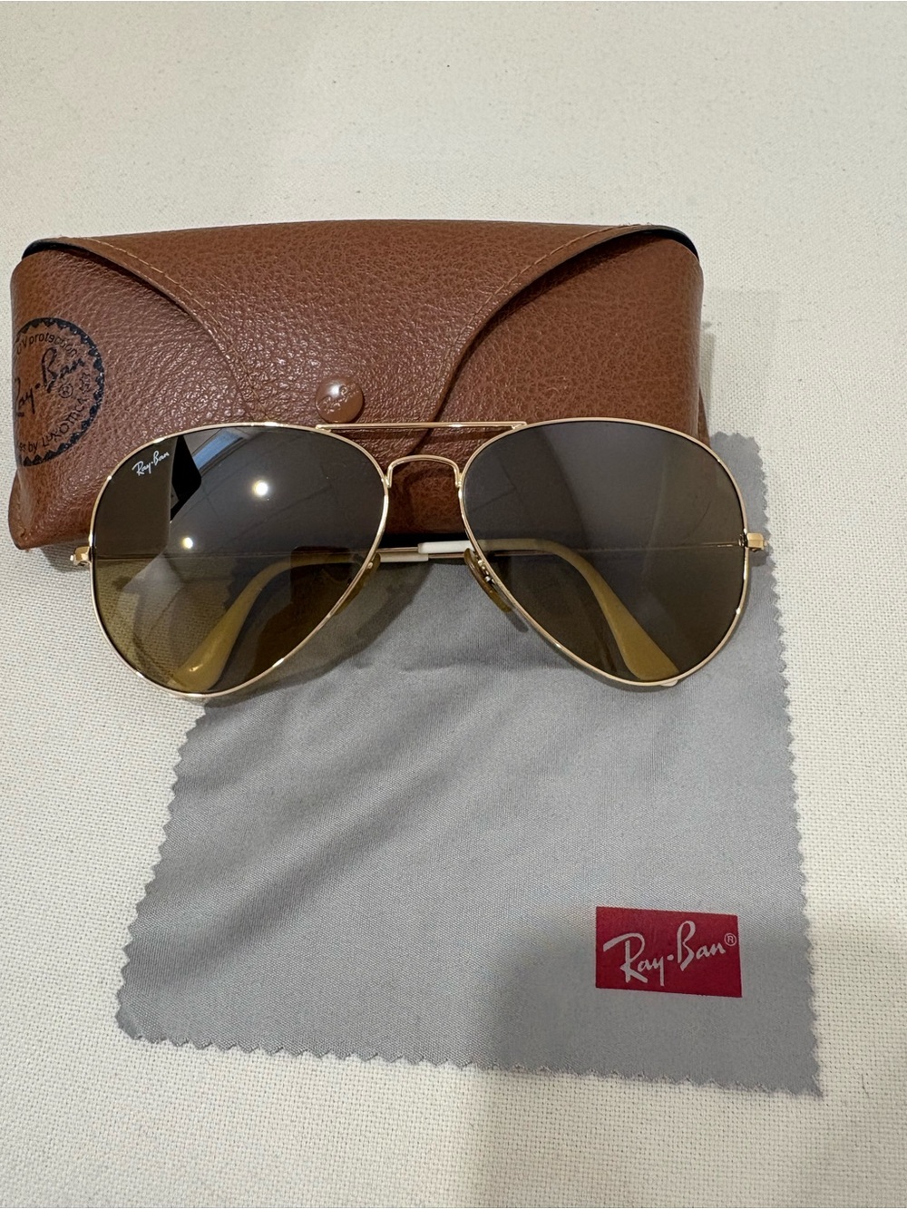Ray-Ban Gold Frame Sunglasses with Brown Gradient Lenses and White Temple Tips